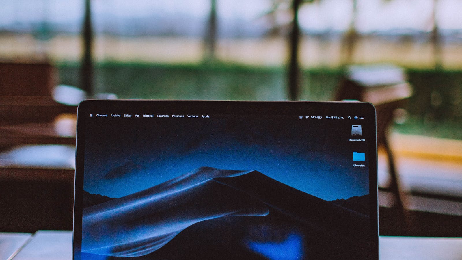Person shopping online with a laptop and card using everyday privacy tools