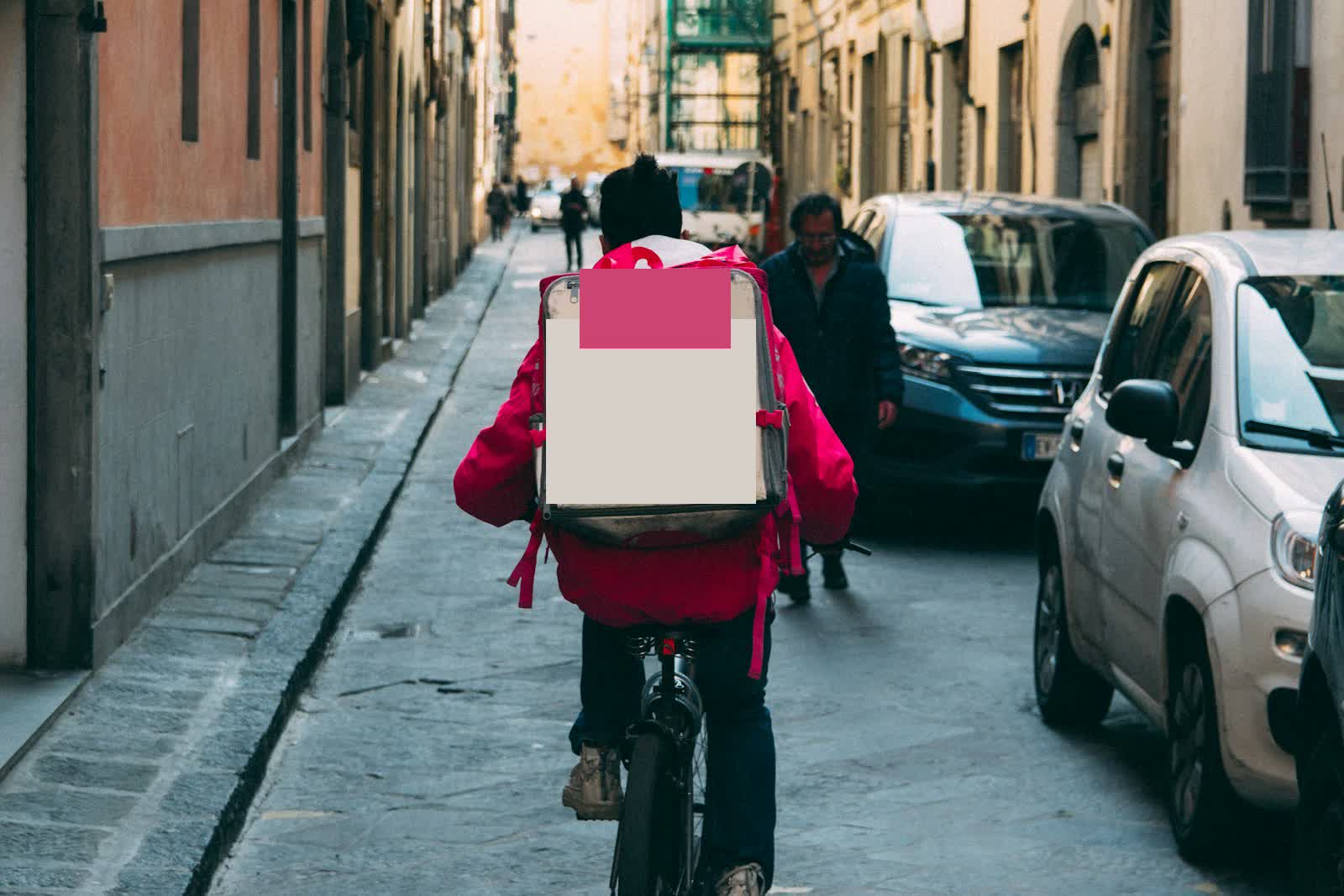Gig delivery worker in a city representing lowball offers and poverty signaling
